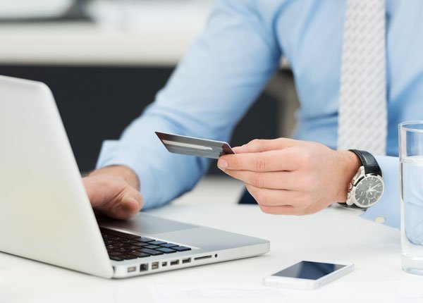 Man making a purchase on laptop