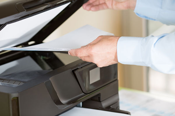 Man making a copy of something in printer