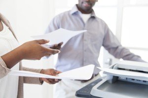 African Business Partners making copies on the printing machine.