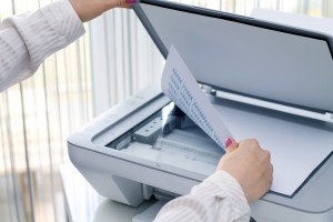 Woman scan some documents at work