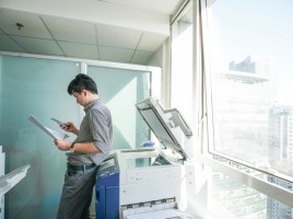 A man using a printer