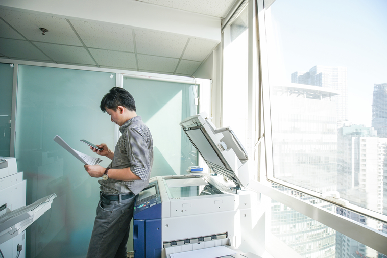 A man using a printer