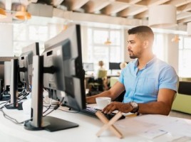 Guy using computer at desk