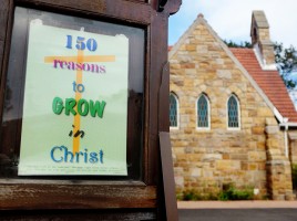 Inspirational Christian message outside suburban church